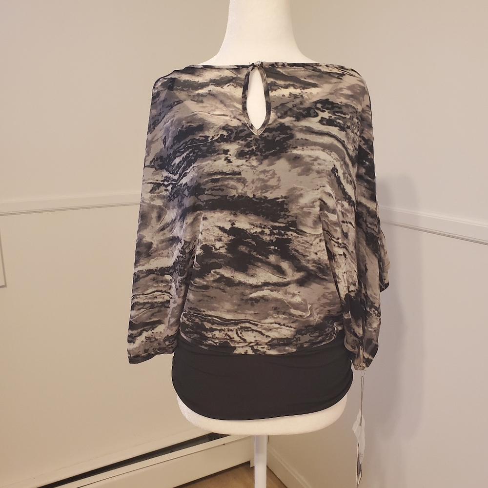 Jennifer Lopez layered top with keyhole closure